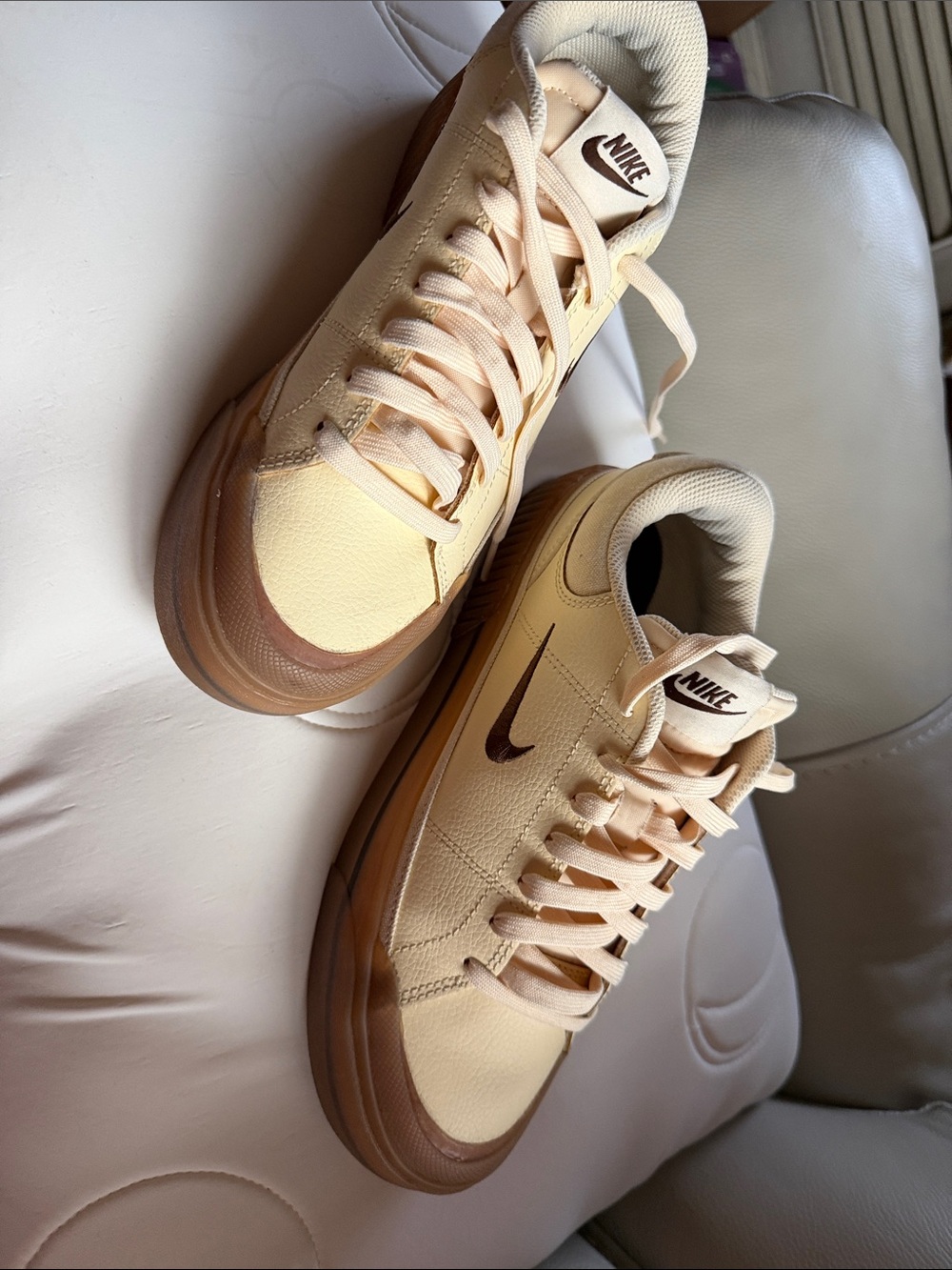 Nike Low-Top Sneakers in Light Peach with Brown Swoosh $75.00